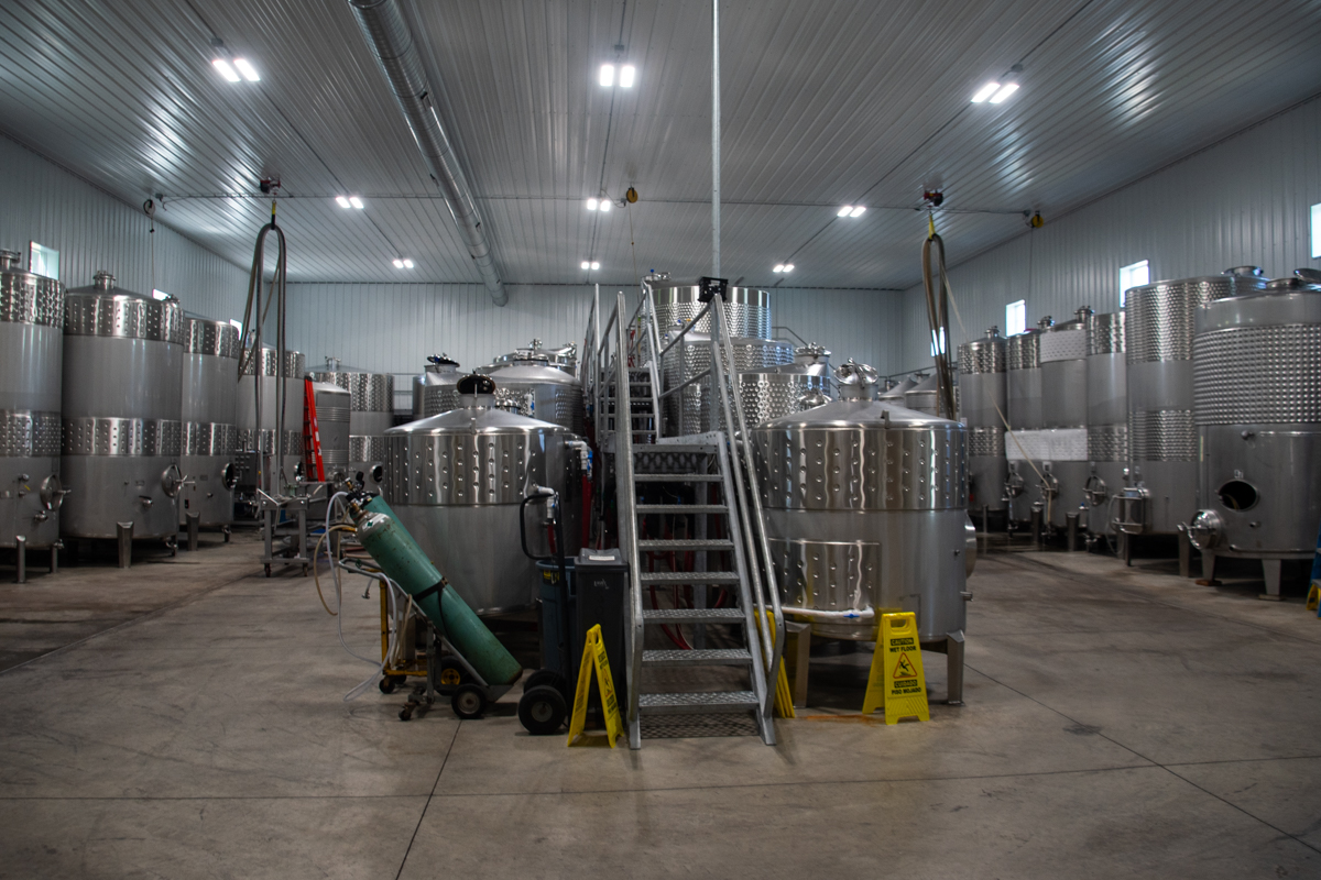Stainless steel fermentation tanks inside Fox Run Vineyards’ production facility.