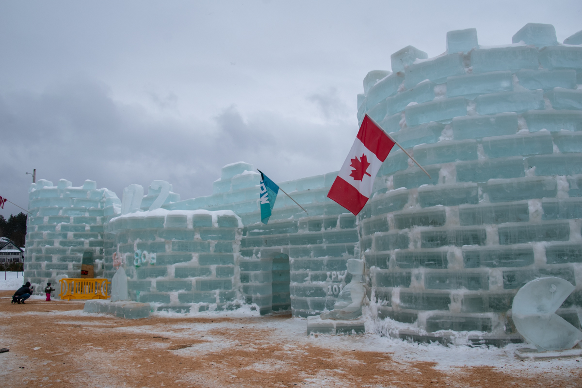 Ice castle in Saranac Lake made of stacked ice blocks during winter festival