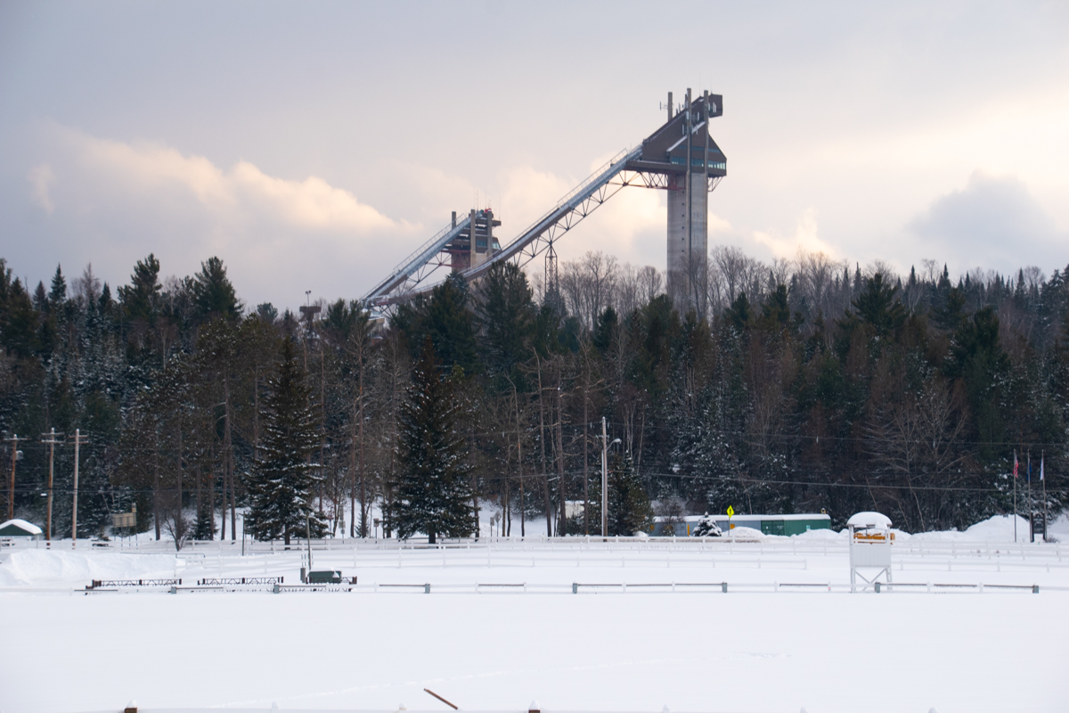 Lake Placid Olympic Jumping Complex in winter surrounded by snow-covered trees