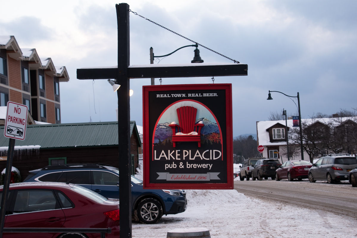 Lake Placid Pub & Brewery sign on Main Street during winter in Lake Placid