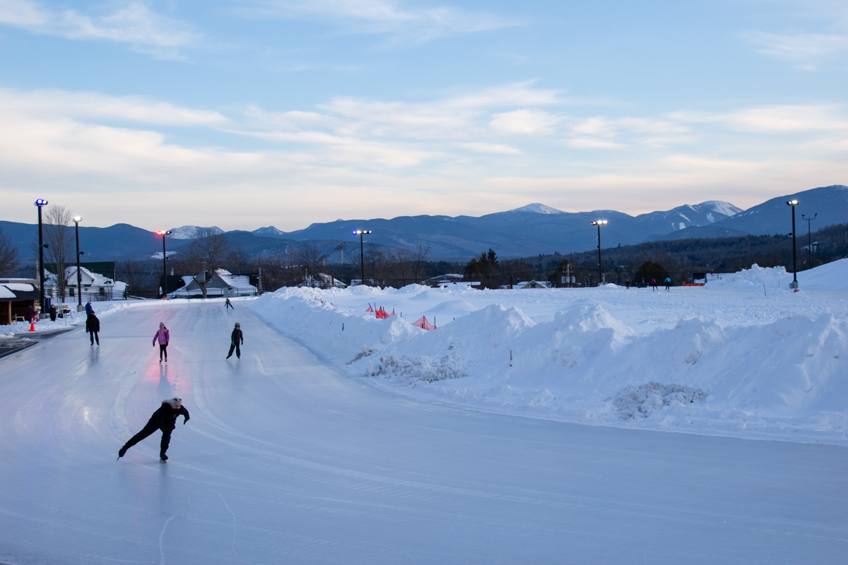 Speed skaters practicing on the Olympic Speed Skating Oval in Lake Placid during winter