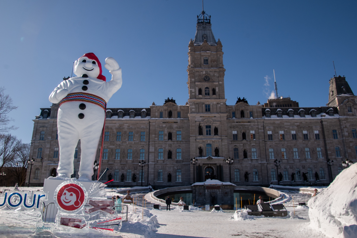 Bonhomme mascot statue during Quebec Winter Carnival in front of Parliament Building