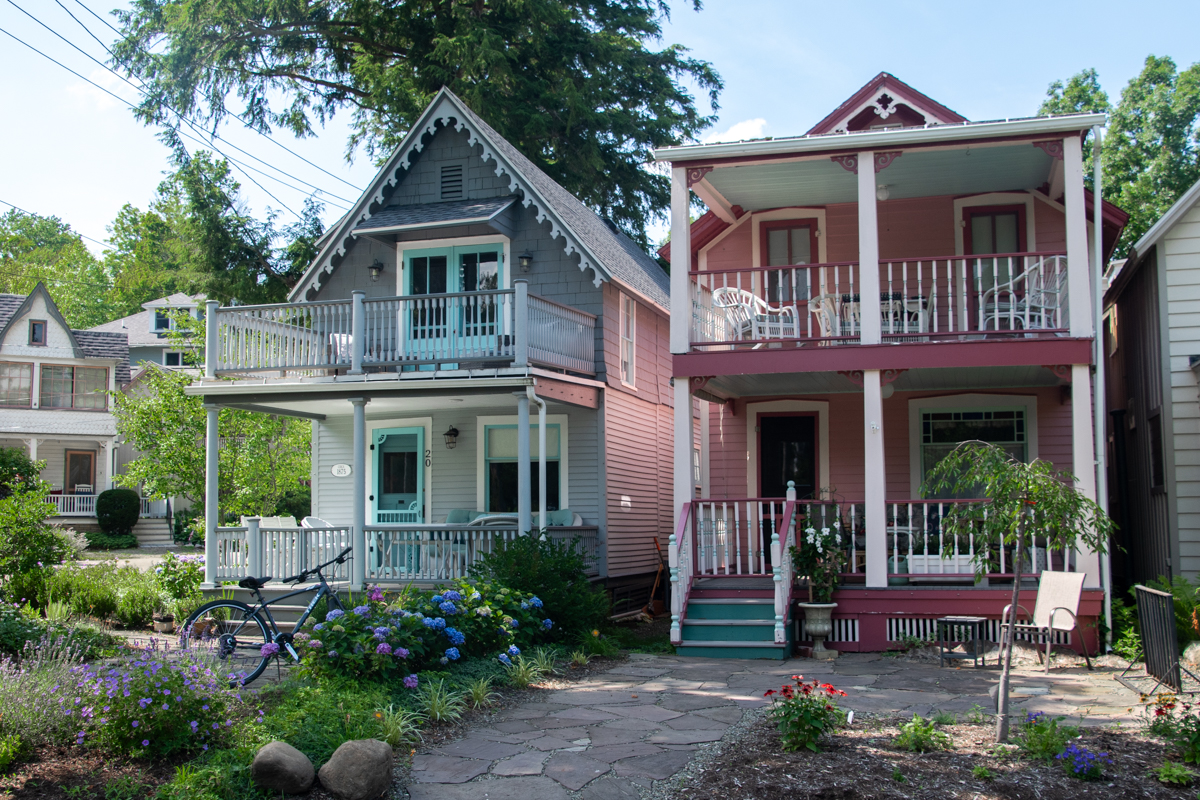 Colorful Victorian cottages along a quiet street at Chautauqua Institution, New York.