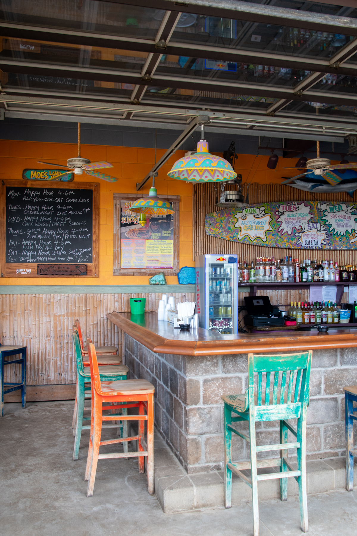 Colorful beach bar inside Cabana Sam's at Sunset Bay Beach in Irving, New York.