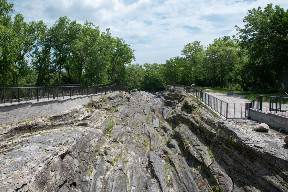 Glacial Grooves Geological Preserve on Kelleys Island, Ohio, featuring massive limestone grooves carved by glaciers and elevated boardwalks overlooking the historic geological formation.