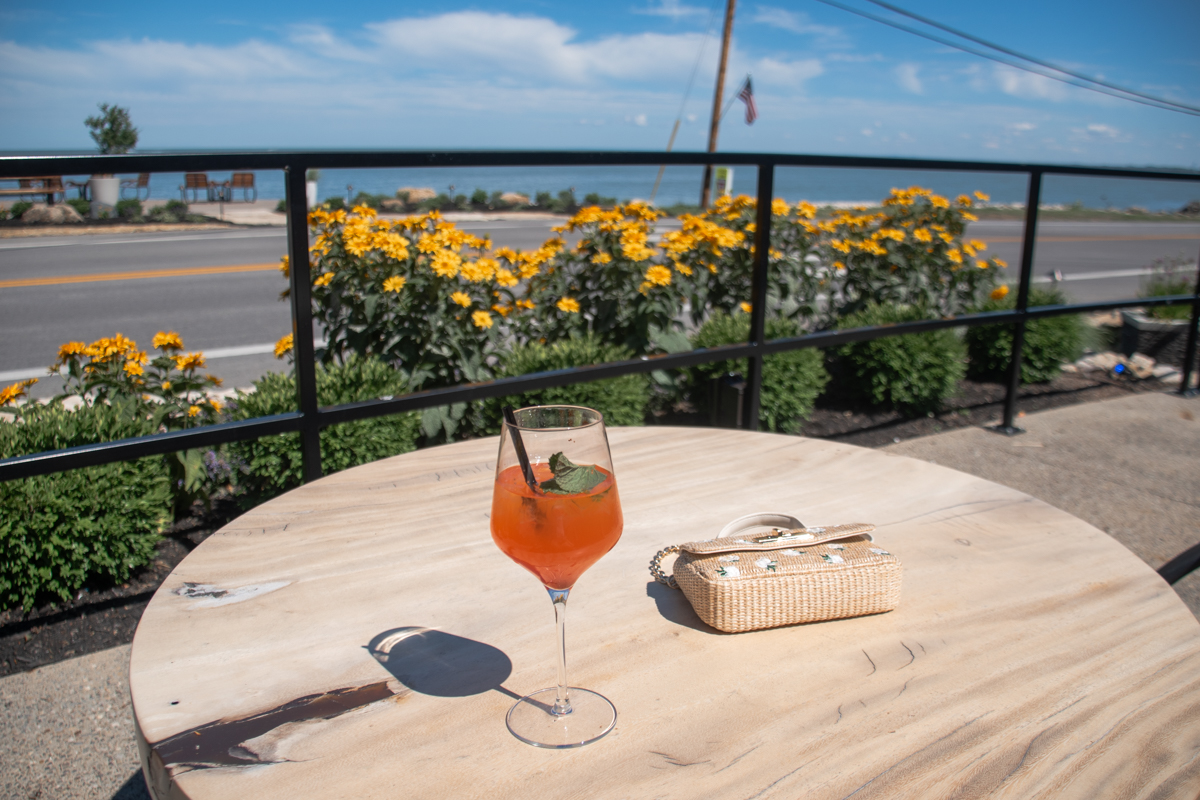 Cocktail on the waterfront patio at The Wave at Marblehead overlooking Lake Erie.